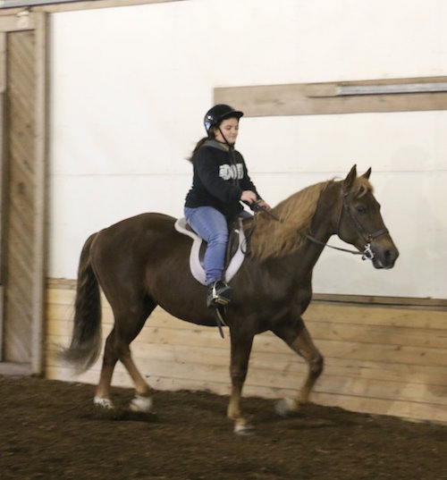 Chrislar student in riding lesson