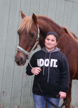 girl with horse at camp day